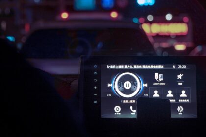 A dashboard of a car at night time