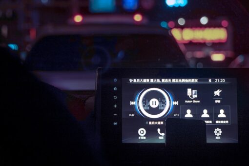 A dashboard of a car at night time
