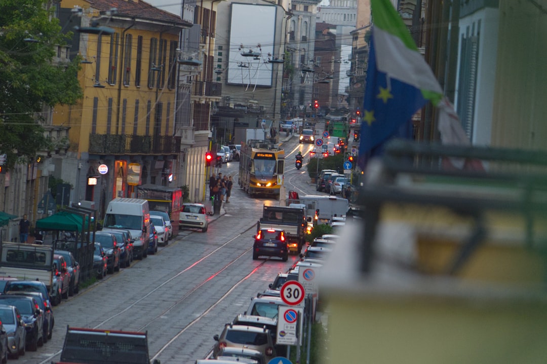 Street scene with tram and cars in european city.