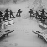 Toy soldiers and jets arranged on a map