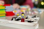 lego mini figure on white computer keyboard
