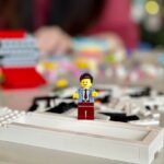 lego mini figure on white computer keyboard