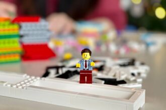 lego mini figure on white computer keyboard