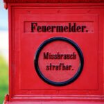 a red mailbox with a message written on it