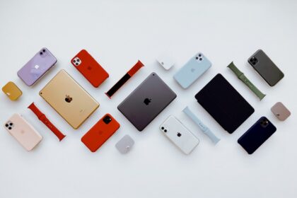 a group of different colored cell phones sitting next to each other