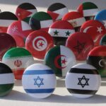 a bunch of different colored balls with flags on them
