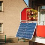 Solar panel on a balcony with plants