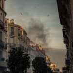 white concrete building with black smoke outdoor