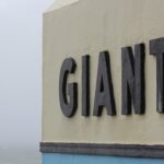 a sign on the side of a building that says giant