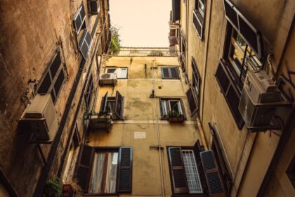 low-angle photography of yellow high-rise buildings