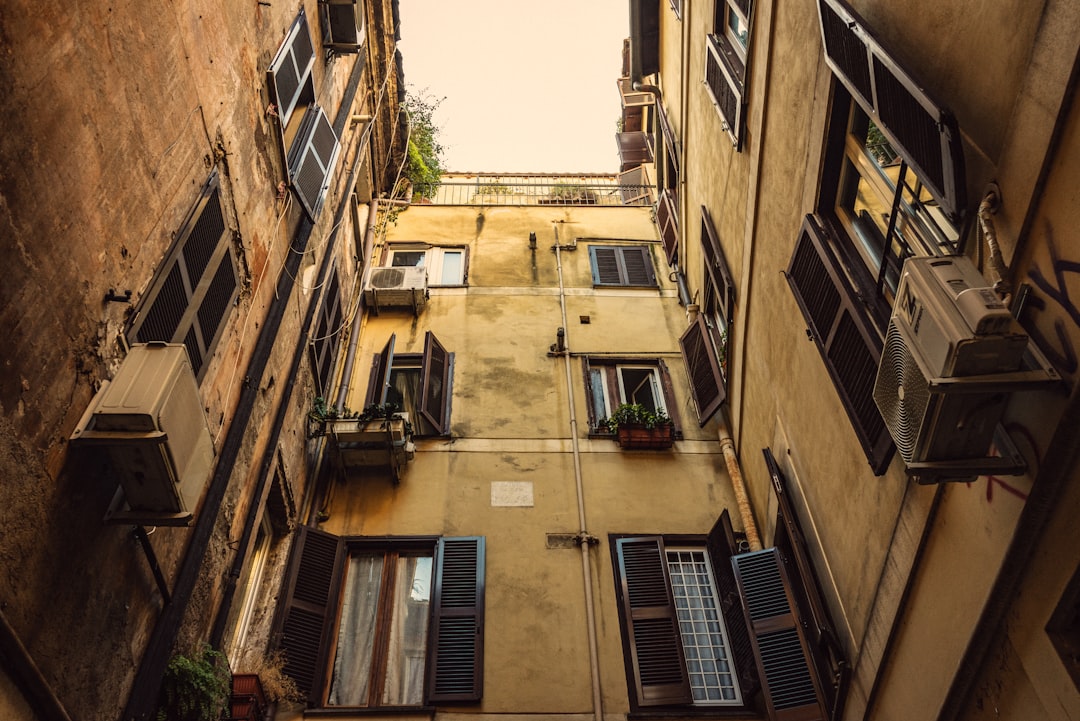 low-angle photography of yellow high-rise buildings