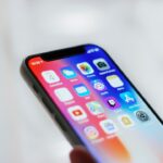 person holding black iphone 4