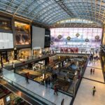 a mall filled with lots of people walking around