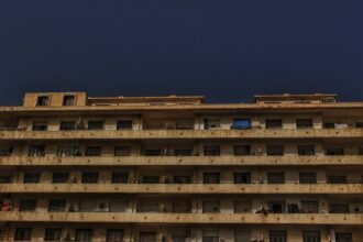 a tall building with balconies and balconies on the balconies