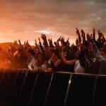 a group of people raising their hands