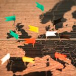 A map of the world with pins pointing in different directions