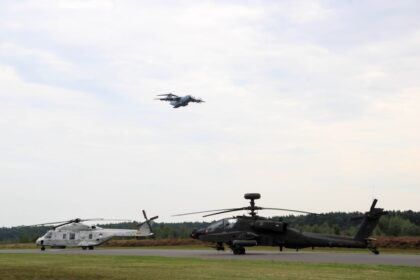 A helicopter and a helicopter on a runway