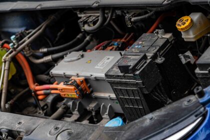 Electric car engine with visible wiring and battery components