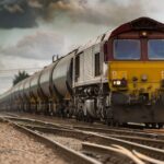 yellow and black train on railways