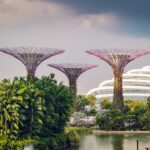 three multicolored landmarks under blue and white sky