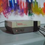 NES console beside wall