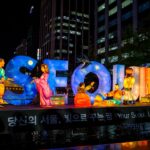 Illuminated figures and large letters spelling SEOUL at the Seoul Lantern Festival at night