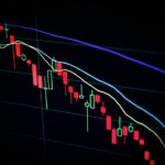 stock market candlestick chart on dark screen