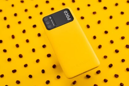 black samsung android smartphone on yellow and white polka dots textile