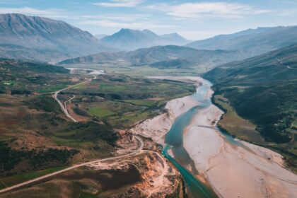 an aerial view of a river running through a valley
