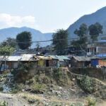 a group of houses sitting on top of a hillside