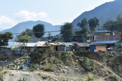 a group of houses sitting on top of a hillside