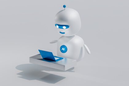 a white robot with blue eyes and a laptop