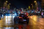 a city street filled with lots of traffic at night