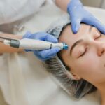 a woman getting a facial peel from a doctor