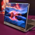 Modern laptop displaying a vibrant landscape on screen.