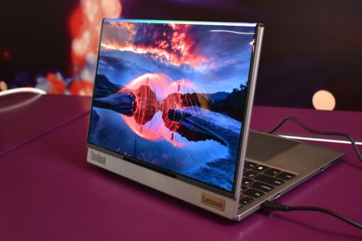 Modern laptop displaying a vibrant landscape on screen.