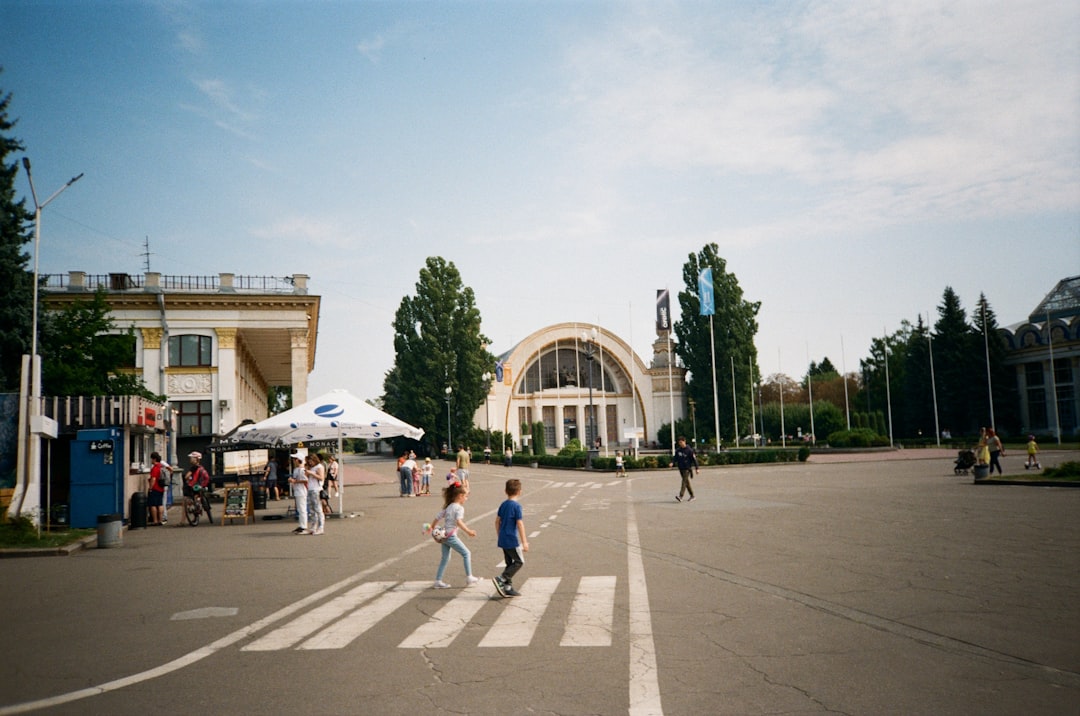people walking in a plaza